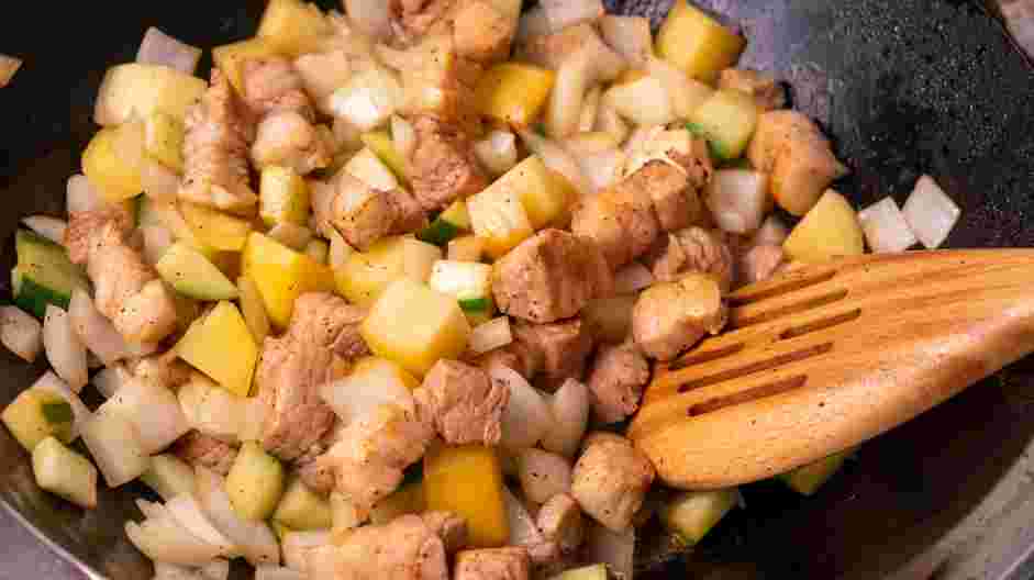 Korean Black Bean Noodles Recipe: Add the onions, potatoes and zucchini to the saucepan and cook until the vegetables have softened, about 6-8 minutes.