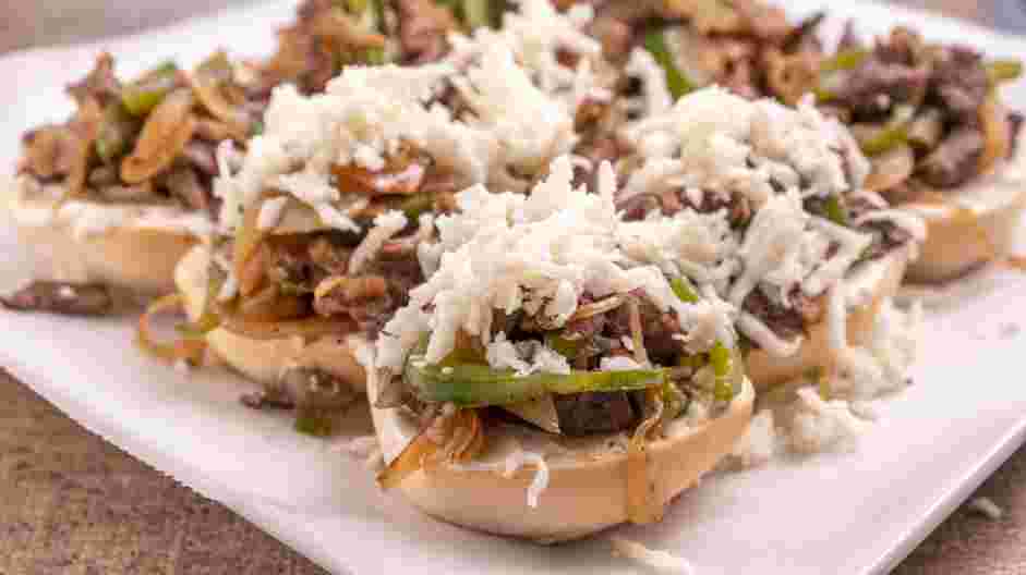 Philly Cheesesteak Sliders Recipe: 
Sprinkle the provolone cheese and the mozzarella cheese over the steak mixture.