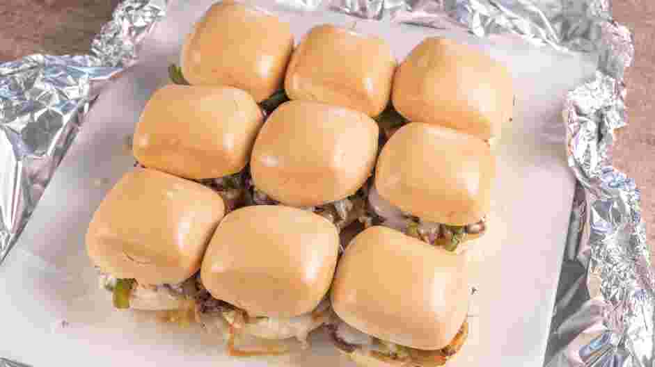 Philly Cheesesteak Sliders Recipe: Remove the foil and bake for an additional 10 minutes or until the cheese has melted.