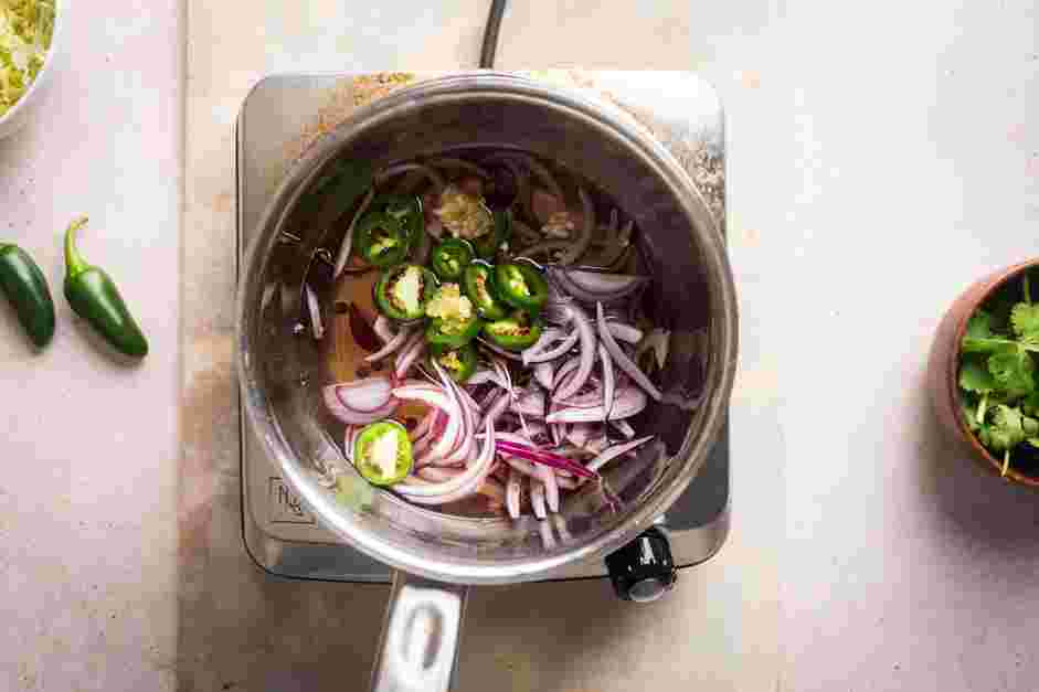 Stuffed Sweet Potatoes Recipe: 
Turn off the heat and add the onions, jalape&ntilde;os and garlic to the pot.