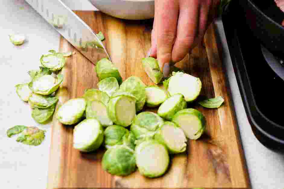 Brussels Sprouts and Bacon Recipe: Meanwhile, cut the core end off the Brussels sprouts and cut them in half.