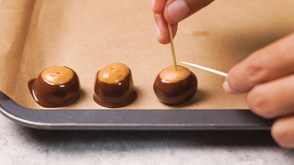 Buckeye Cookies Recipe: 
Transfer the buckeye to the baking sheet sprinkle with flaky sea salt, if using.