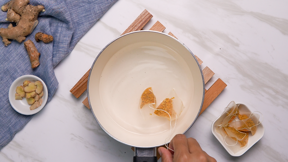 Turmeric Latte Recipe: In a small pot, steep the tea bags with boiling hot water.