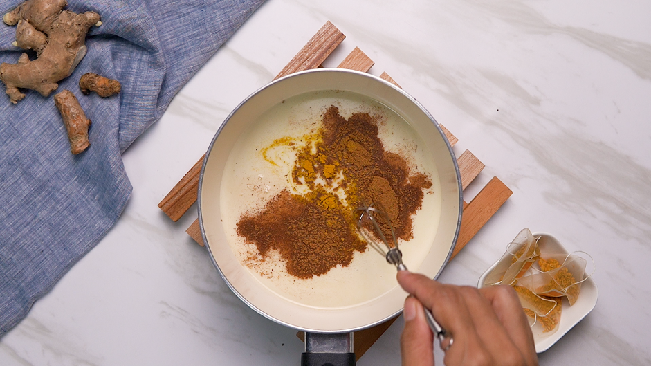 Turmeric Latte Recipe: Remove the tea bags and add the ginger, coconut milk, coconut sugar, cinnamon and ground turmeric.