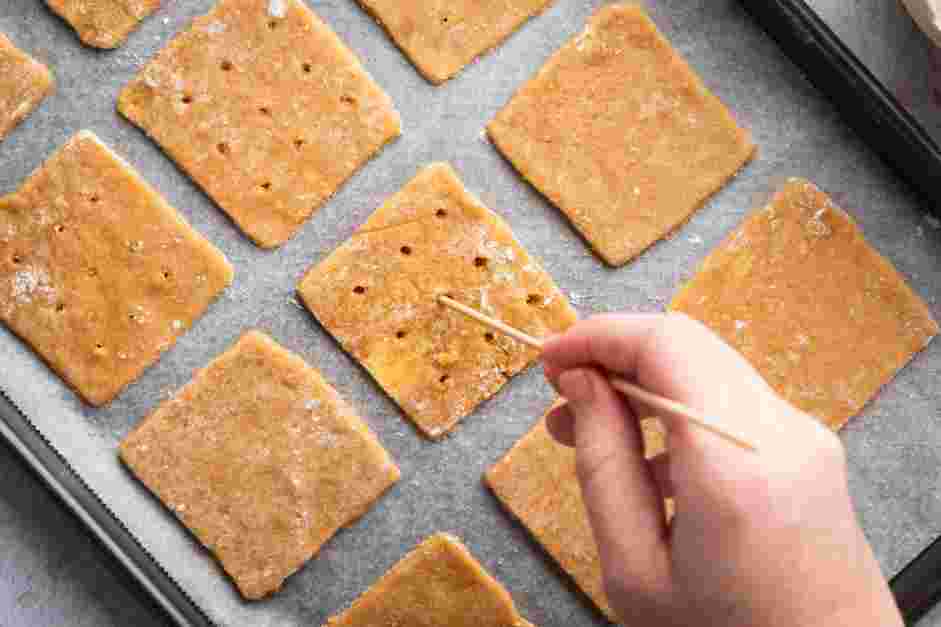 Cinnamon Graham Crackers Recipe: Using the end of a skewer or a fork, poke nine holes into the dough, like a cracker.