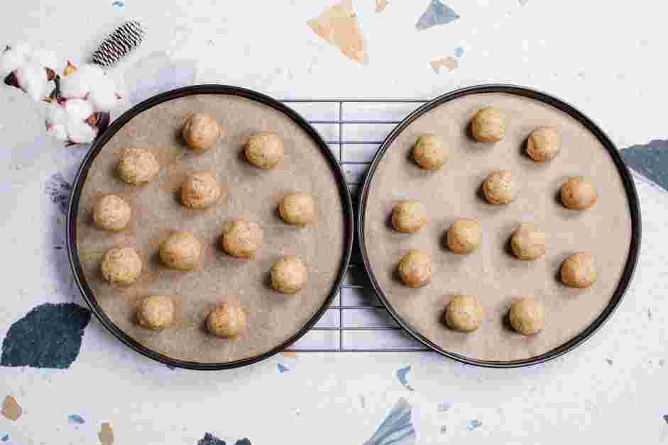 Snowball Cookies Recipe: Preheat the oven to 325&deg;F and line two baking sheets with parchment paper.