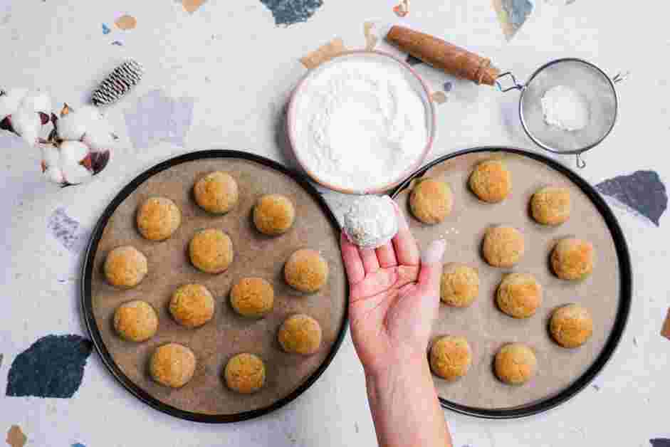 Snowball Cookies Recipe:
While the cookies are baking, add the confectioner’s sugar in a shallow bowl.