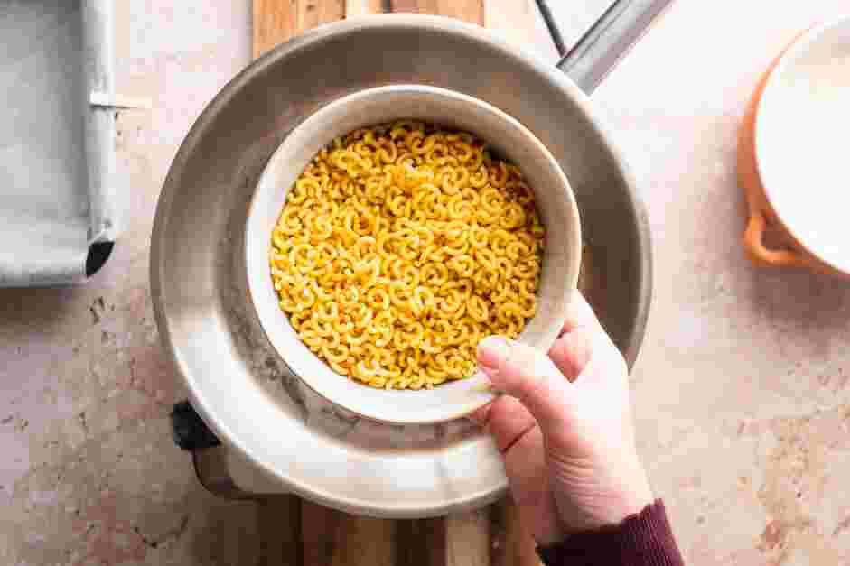 Fried Mac and Cheese Recipe: 
In a large skillet over high heat, add the pasta and enough water to barely submerge the macaroni.