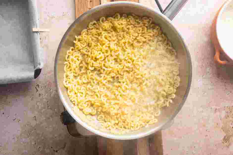 Fried Mac and Cheese Recipe: 
Once the mixture has reached a boil, continue to stir constantly and cook until the pasta is almost al dente, about 6 minutes.