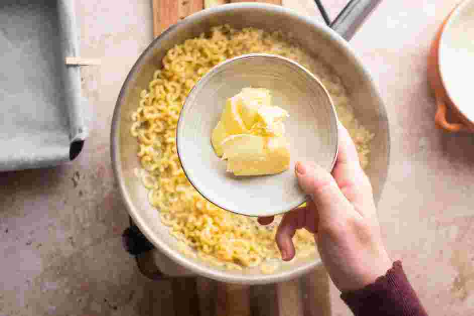 Fried Mac and Cheese Recipe: 
Add the butter to the pot and toss to coat the macaroni in butter.