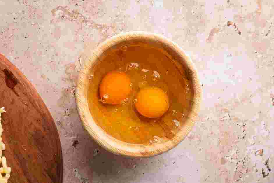 Fried Mac and Cheese Recipe: In a second shallow bowl, whisk together the eggs and the water.