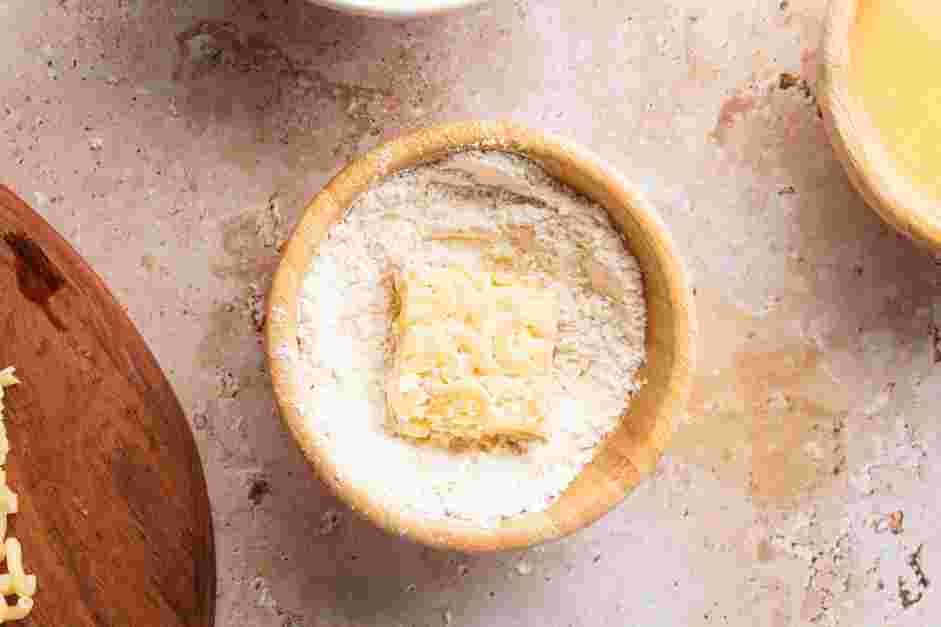 Fried Mac and Cheese Recipe: 
Coat the cubes of macaroni in the flour mixture and shake off the excess.