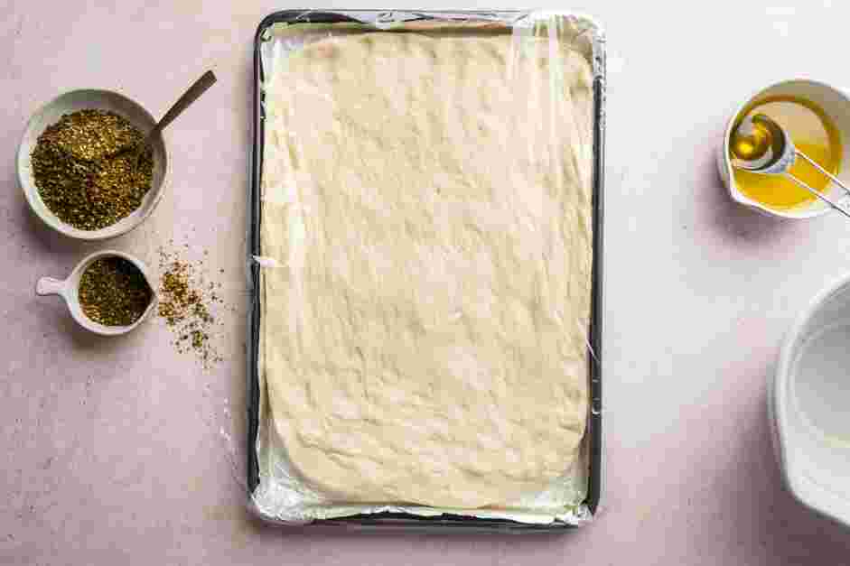 Zaatar Bread Recipe: 
Loosely cover the baking sheet with plastic wrap and let the dough rise for 1 hour.