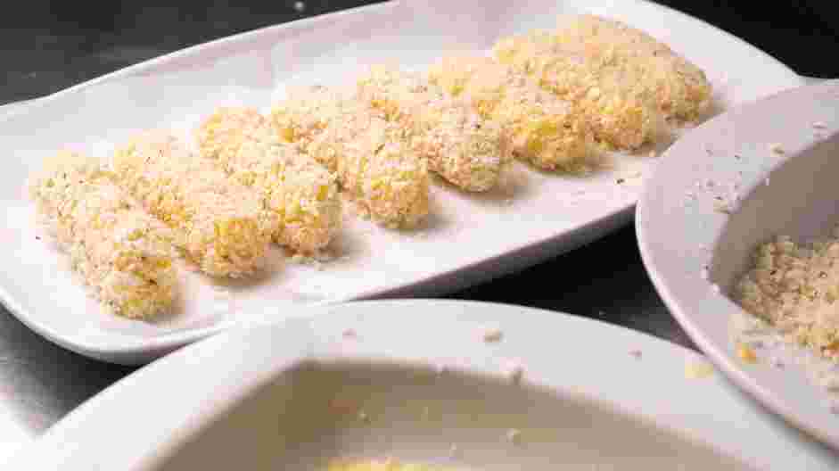 Air Fryer Mozzarella Sticks Recipe:
Roll the mozzarella stick into the seasoned panko, packing the panko into the mozzarella stick as you roll them.