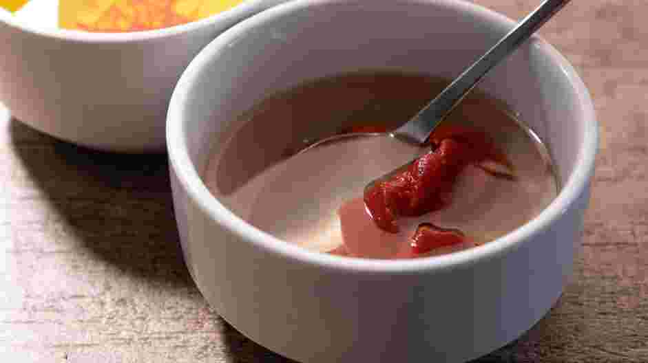 Braised Chicken Thighs Recipe: In a second small bowl, stir together the tomato paste with ½ cup of white wine or water.