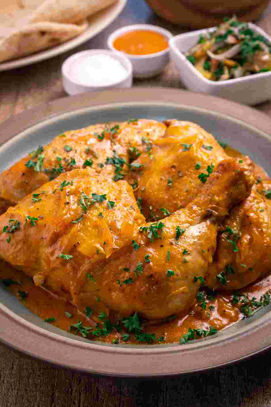 Braised Chicken Thighs Recipe: 
Using tongs, gently arrange the chicken on a warmed platter or shallow bowl.