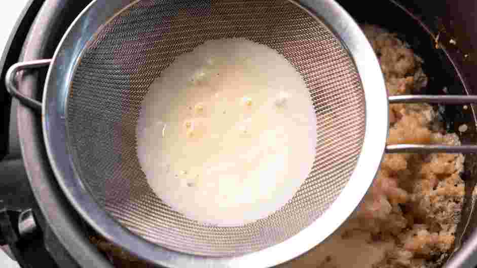 Instant Pot Rice Pudding Recipe: 
Place a fine-meshed strainer on top of the pot and pour the milk mixture into the pot.