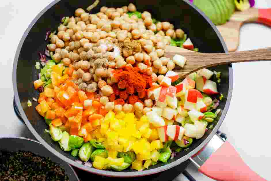 Rainbow Quinoa Bowl Recipe: 
Add the yellow and orange bell peppers, chickpeas, apples, paprika, cumin salt and pepper.