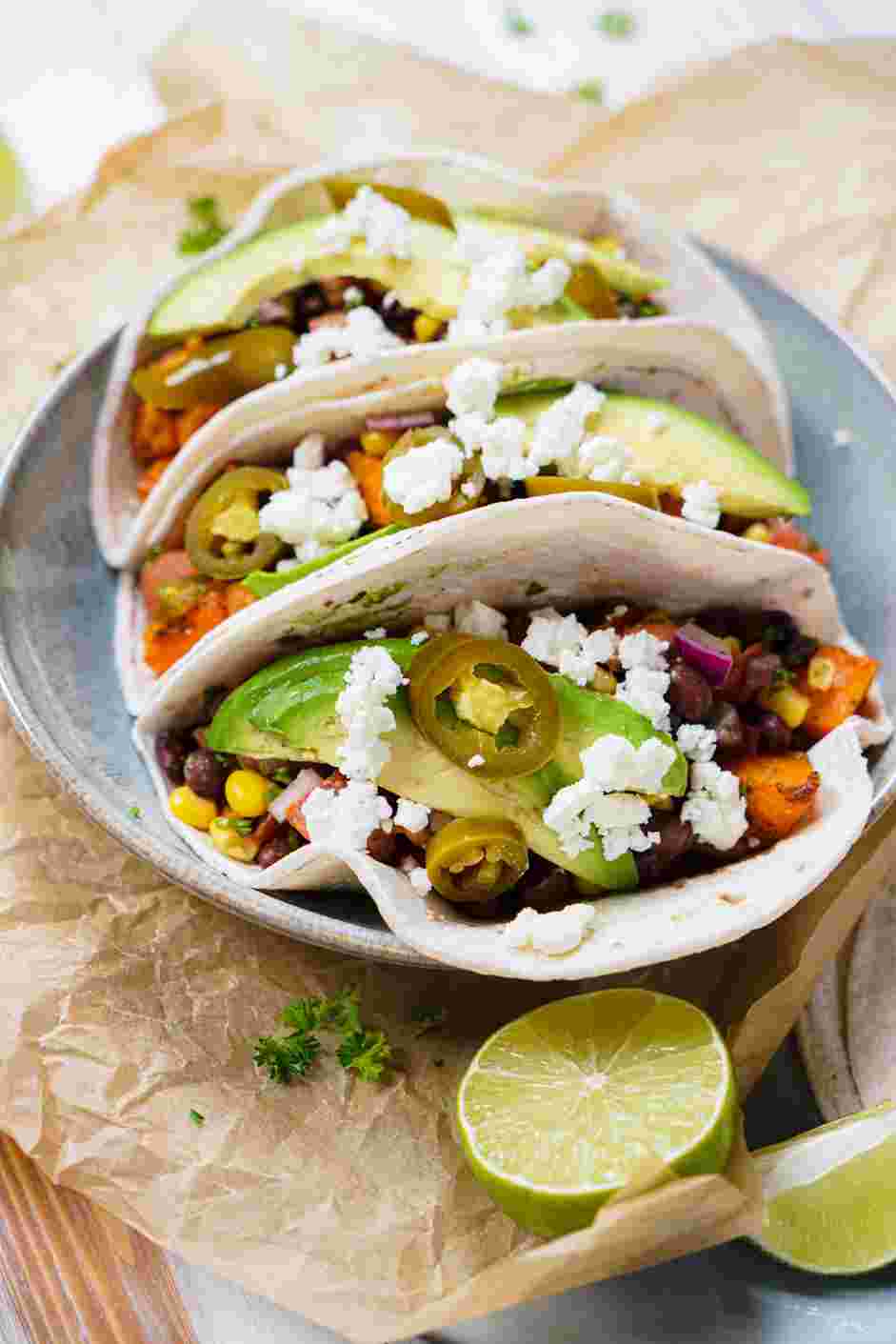 Sweet Potato Black Bean Tacos Recipe: Top with the pickled jalapeños and the crumbled queso fresco.