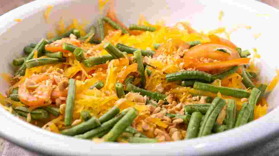 Thai Papaya Salad Recipe: 
In a large bowl, add the shredded green papayas, tomatoes, roasted peanuts and the long beans.