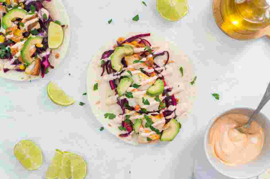 Cod Fish Tacos Recipe: Top the cod with the sriracha crema, avocado, fresh cilantro and a squeeze of lime.