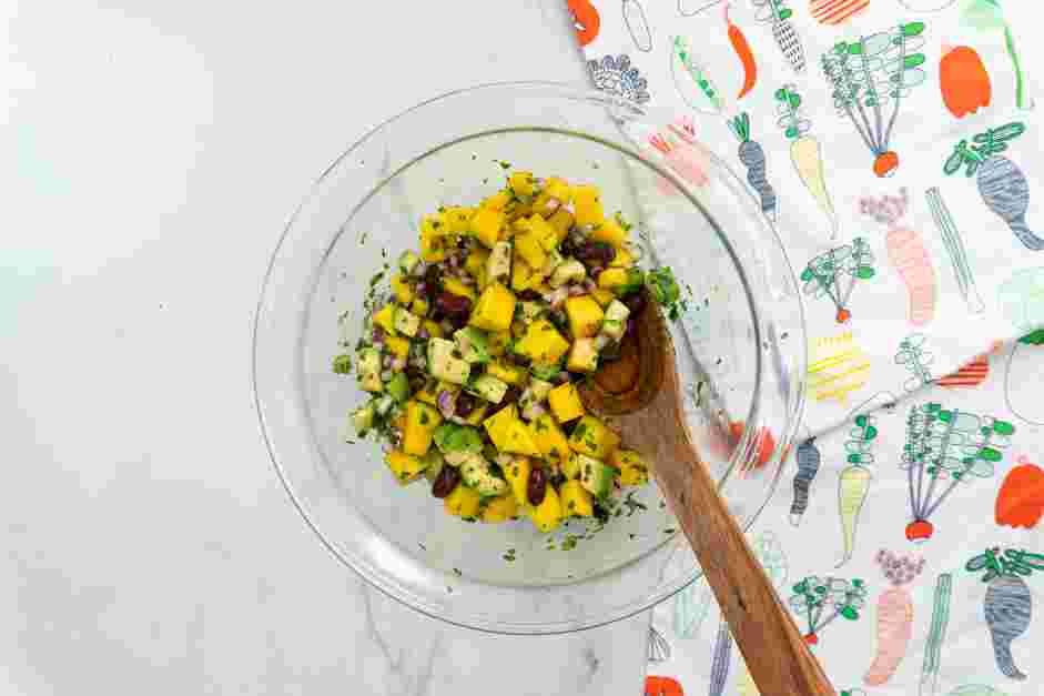 Mango Avocado Salsa Recipe: In a bowl, add the diced mangoes, diced avocados, black beans, red onion, cilantro, orange juice, lemon juice, garlic and salt.