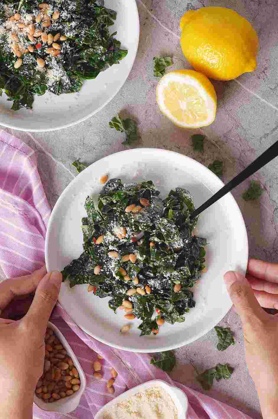 Lemon Kale Salad Recipe: Top the lemon kale salad with pine nuts and cheese.