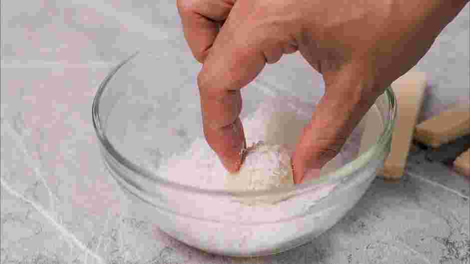 White Chocolate Truffle Recipe:
Dip the white chocolate sphere into the coconut flakes, rolling it back to a spherical shape if needed.