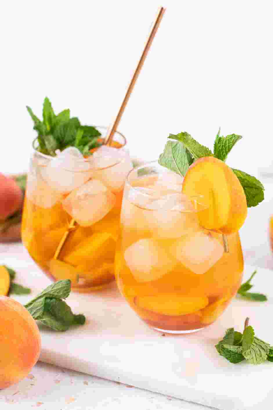 Peach Tea Recipe:
Use a fine-meshed filter to fill the glasses with the cold-brewed black tea.