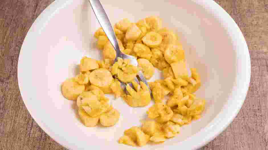 Banana Fritters Recipe:
In a large mixing bowl, place the unpeeled bananas.