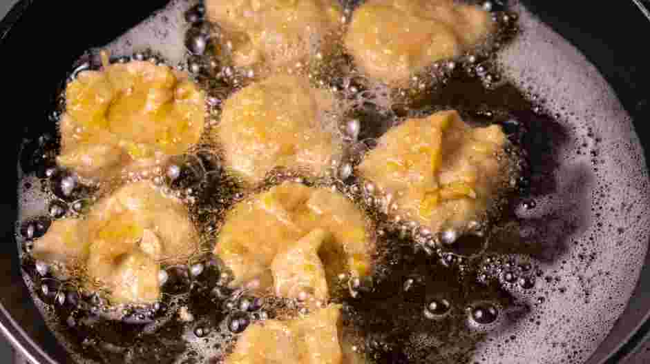 Banana Fritters Recipe: 
Fry on one side and when the edges look brown or slightly crispy, flip to cook the other side.