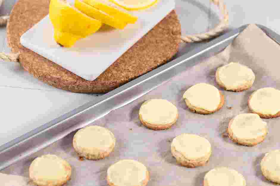 Lemon Shortbread Cookies Recipe:
Whisk the glaze to loosen it up and dip the tops or one half of each cookie into the glaze, then return to the rack to allow the glaze to set.