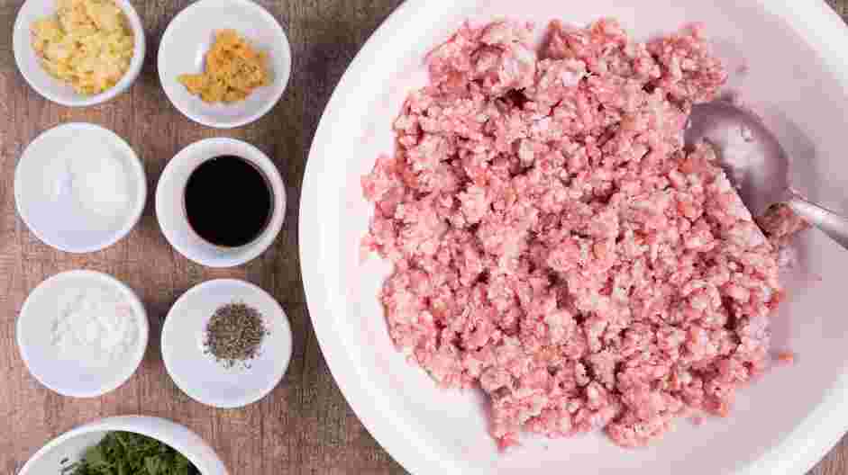 Moo Ping (Thai Pork Skewers) Recipe:
In a large bowl, combine the ground pork, crushed garlic, chopped cilantro, sugar and soy sauce.