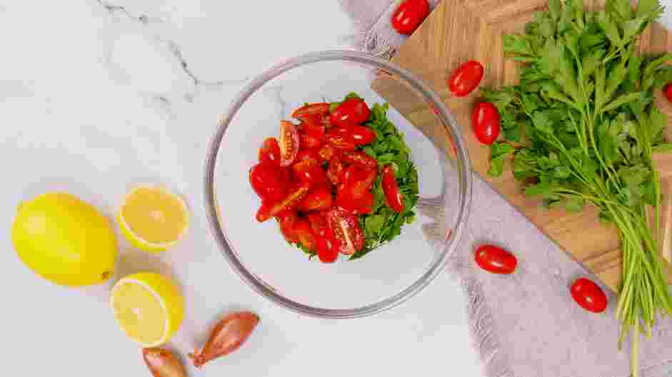 Lentil Tabbouleh Recipe: While the lentils are soaking, add the shallot, parsley, mint and tomatoes to a large bowl.