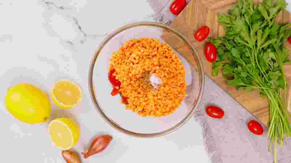 Lentil Tabbouleh Recipe:
Once the lentils have cooled, add the lentils, olive oil, cumin and sea salt into the large bowl with the tomatoes.