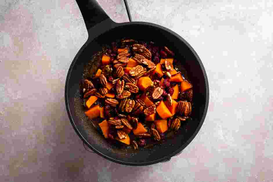 Baked Candied Sweet Potatoes Recipe: 
Fold in the reserved sweet potatoes, dried cranberries and walnuts.