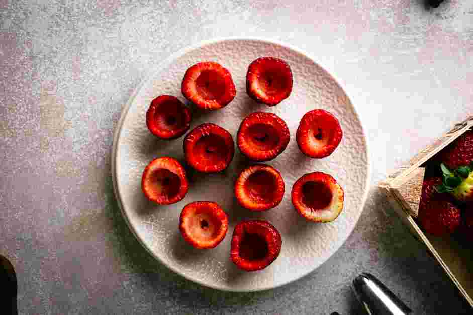 Cheesecake Stuffed Strawberries Recipe:
Use a paring knife to cut the tip of each strawberry, so the strawberries can stand.