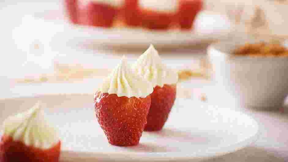 Cheesecake Stuffed Strawberries Recipe: Use the prepared piping bag to fill the strawberries.