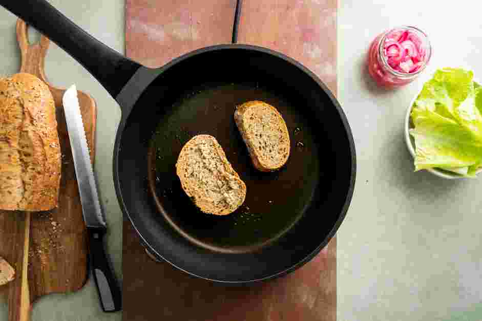 Meatloaf Sandwich Recipe: 
Spread the butter on the outer slices of bread and toast in a large nonstick skillet over medium heat.