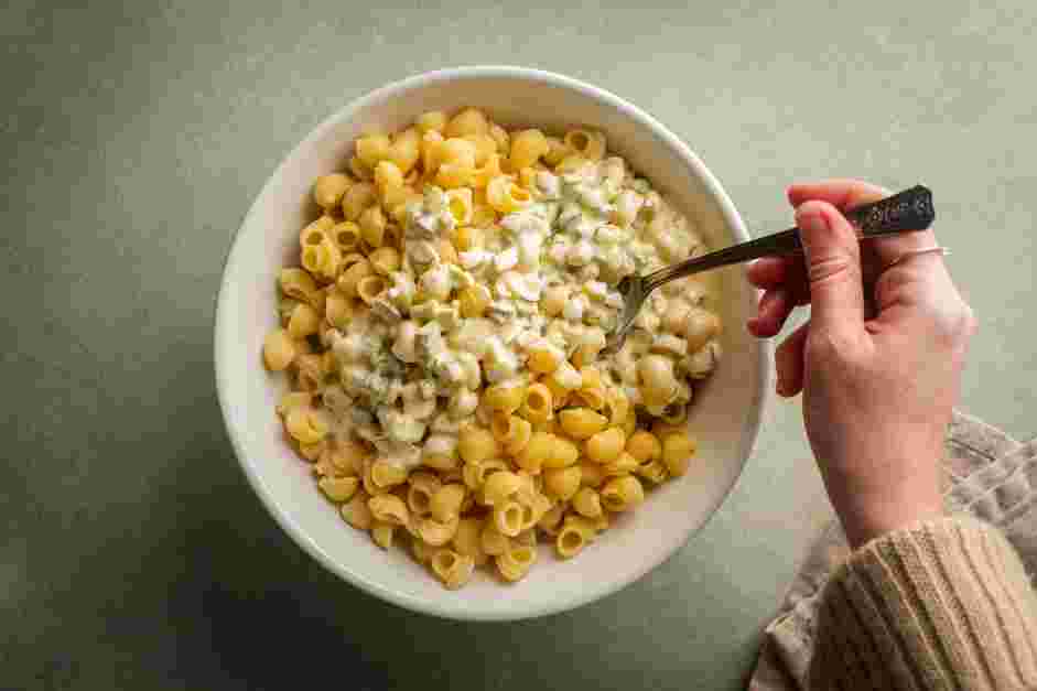 Tuna Pasta Salad Recipe:
Add the pasta and the dressing.