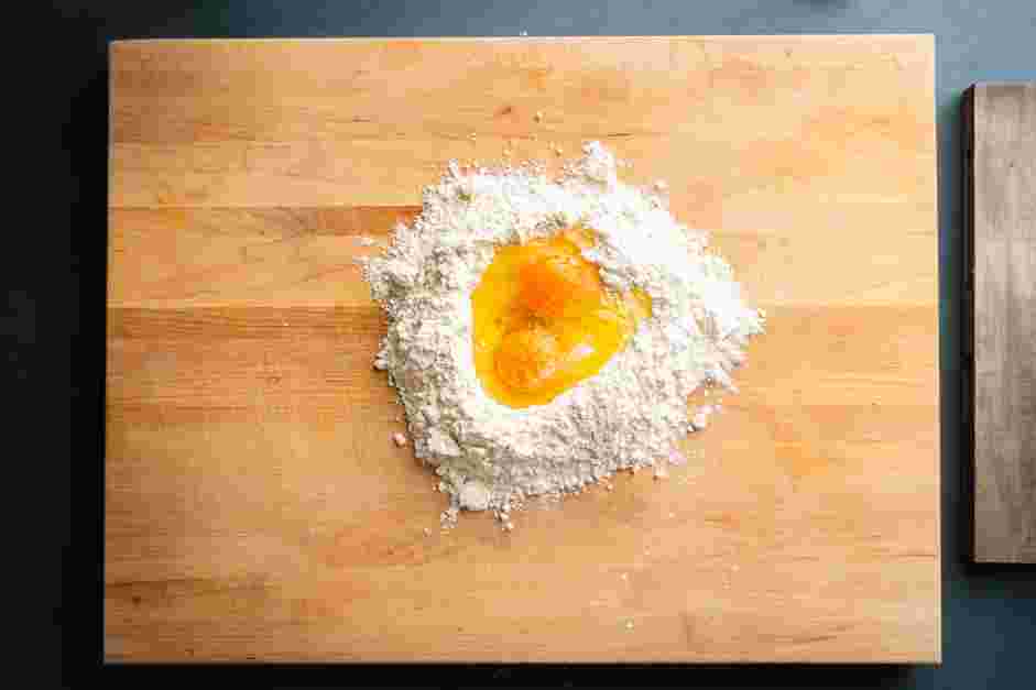 Lasagna Sheets Recipe:
Place the flour on a wooden work surface and create a crater in the center.