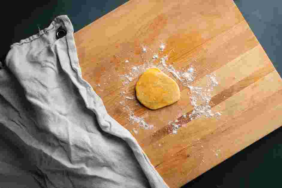 Lasagna Sheets Recipe: 
Take one portion of the dough and cover the remaining dough with plastic wrap.