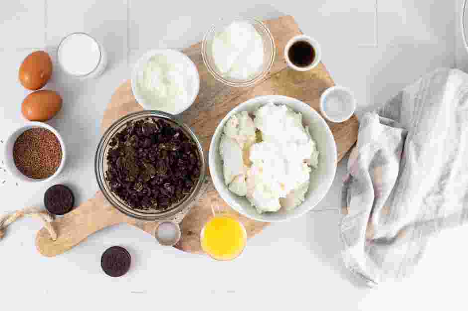 Oreo Cheesecake Bites Recipe: Preheat the oven to 325°F and line an 8x8-inch baking pan with parchment paper.