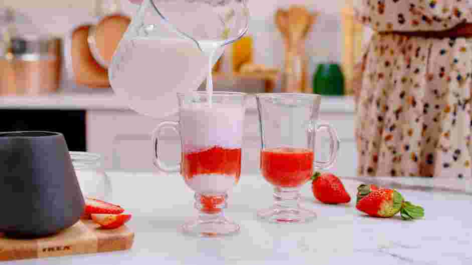 Strawberry Milk Recipe: Top with about a cup of milk and garnish with a sliced strawberry on the lip of the glass.