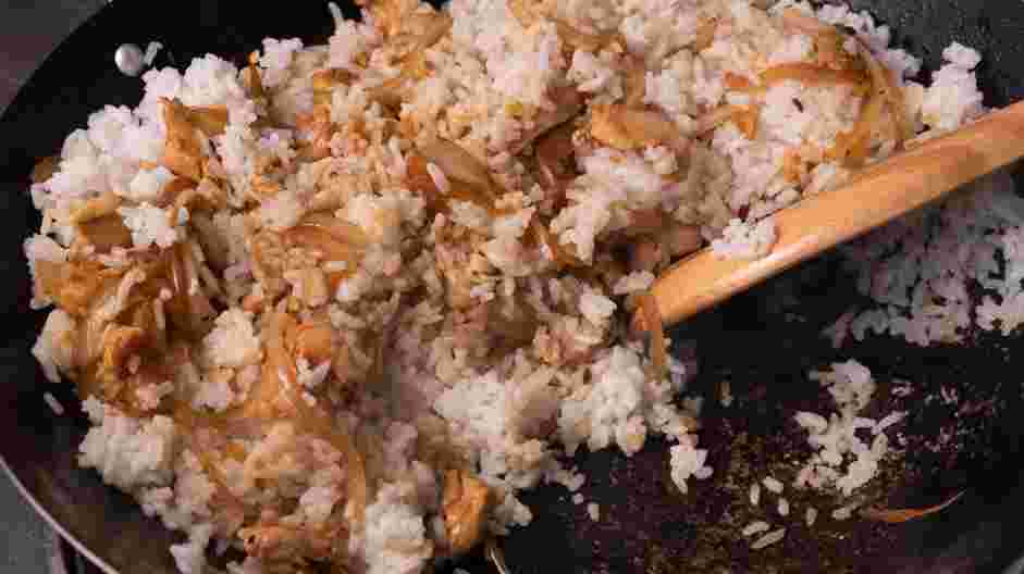 Basil Fried Rice (Kao Pad Nam Prik Pao Gai) Recipe:
Add cooked rice to the skillet and stir carefully to avoid breaking the rice.