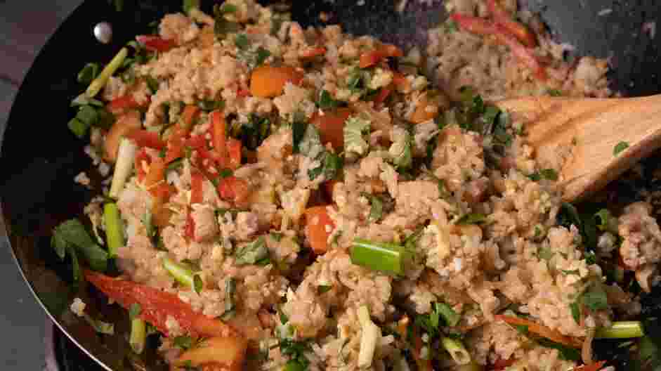 Basil Fried Rice (Kao Pad Nam Prik Pao Gai) Recipe: Add the tomato, sweet peppers, basil leaves, cilantro and green onion.