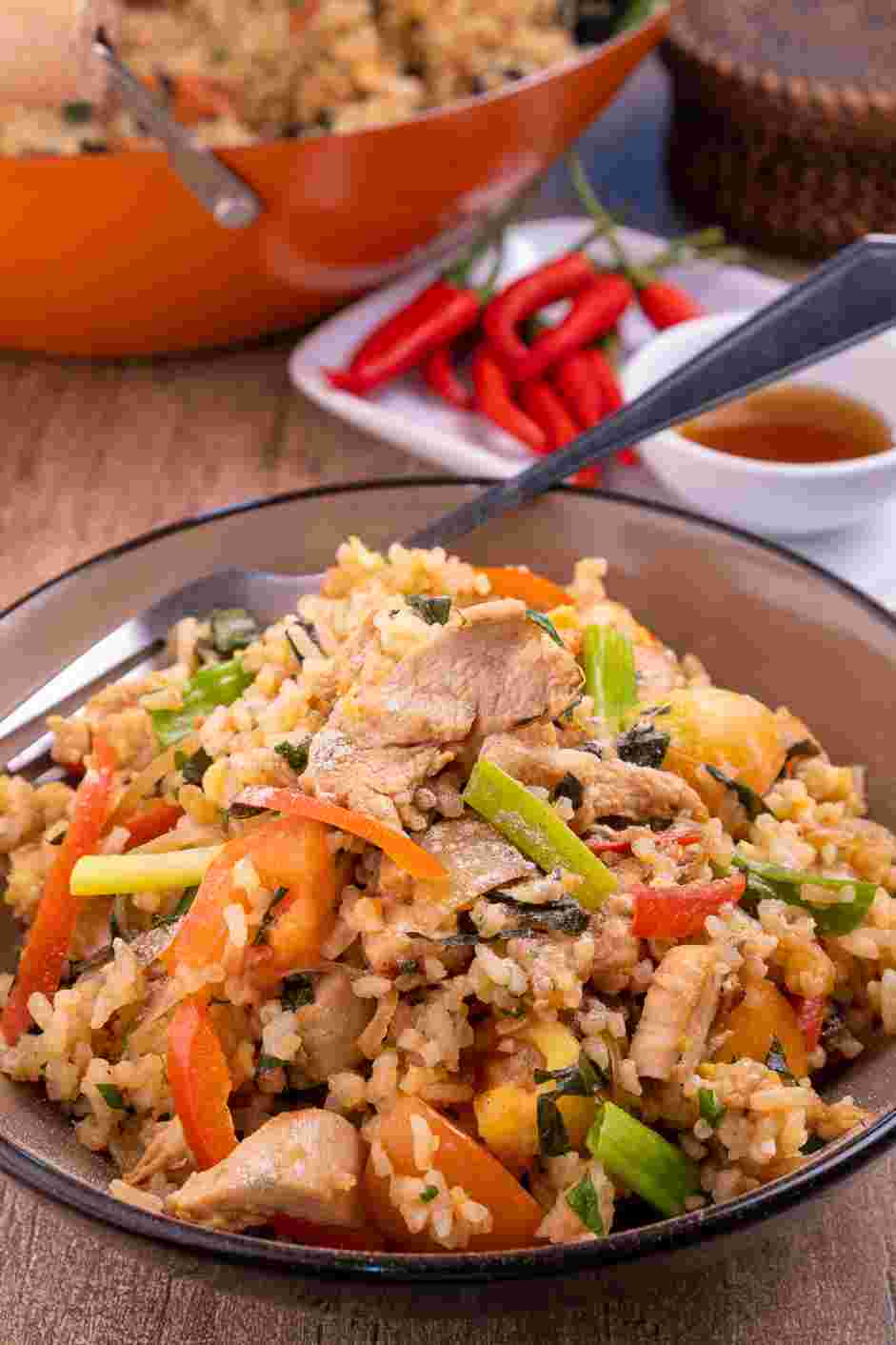 Basil Fried Rice (Kao Pad Nam Prik Pao Gai) Recipe: Garnish with cilantro leaves and white pepper powder.