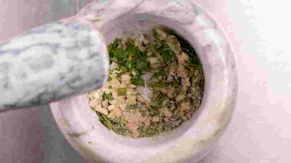 Pork Spring Roll (Por Pia Tod) Recipe:
Using a mortar and pestle, crush 1 tablespoon of cilantro, garlic and white pepper powder together.