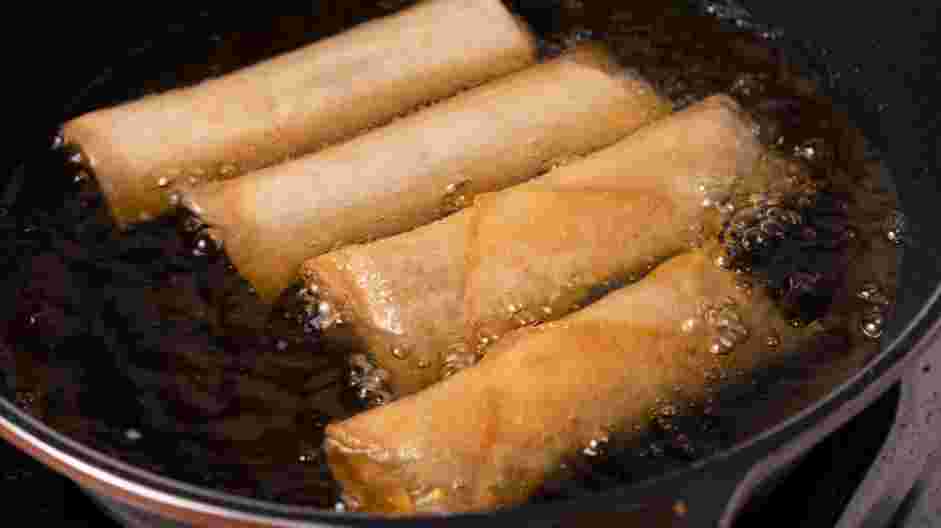 Pork Spring Roll (Por Pia Tod) Recipe: 
Heat oil in a deep skillet over medium heat for frying.