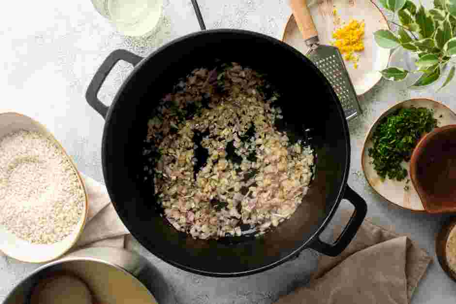 Parmesan Risotto Recipe: Add the garlic cloves and cook until fragrant, about 1 minute.